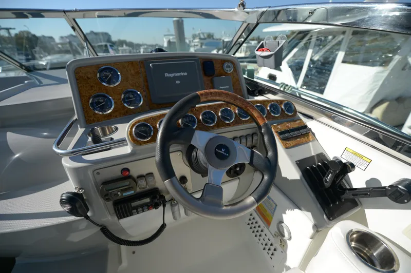 Slide: The Image of 2007 Formula 34 PC yacht helm with steering wheel and navigation instruments. - 49