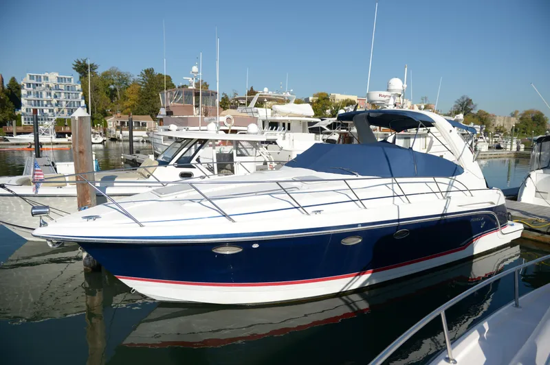 Slide: The Image of 2007 Formula 34 PC yacht docked in a marina under clear blue skies. - 5