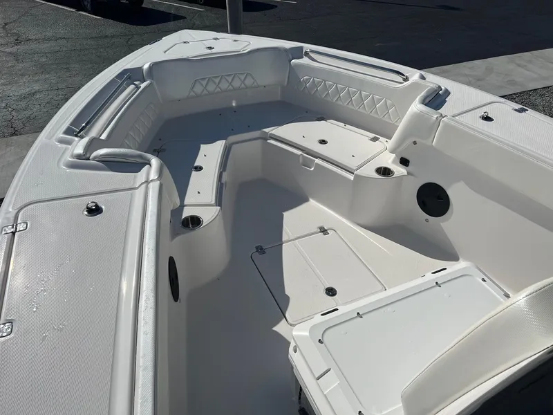 Slide: The Image of 2023 Blue Wave 2600 Makaira boat interior with spacious seating and storage compartments. - 10