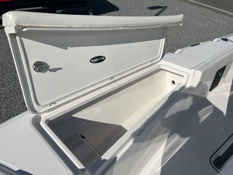 Slide: The Image of 2023 Blue Wave 2600 Makaira boat storage compartment open. - 8