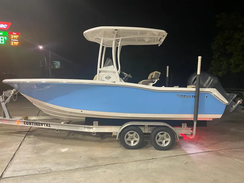 The Image of 2021 Tidewater 210 LXF boat on a Continental trailer at night. - 0