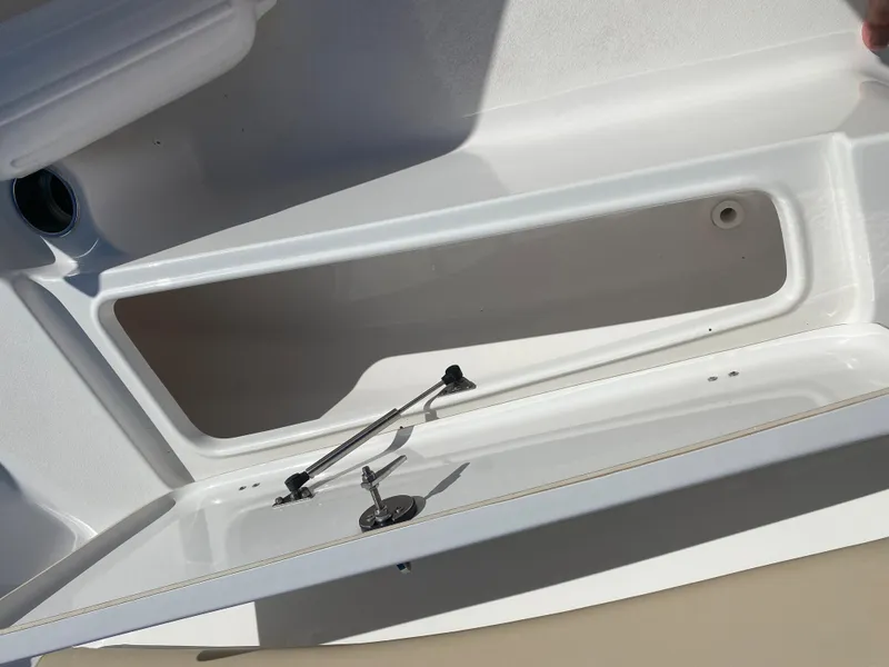Slide: The Image of Open storage compartment on a 2021 Tidewater 210 LXF boat. - 16