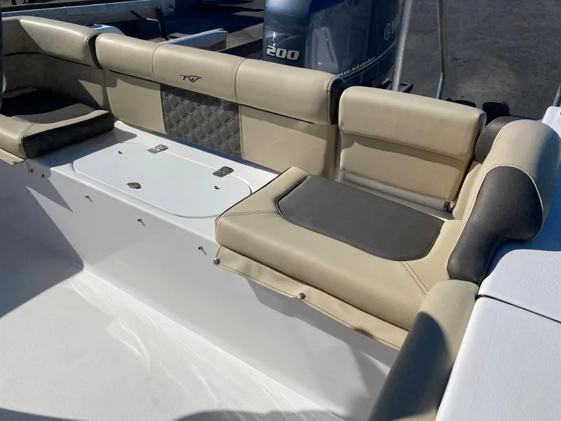 Slide: The Image of 2021 Tidewater 210 LXF boat with beige seating and Yamaha 200 engine. - 20