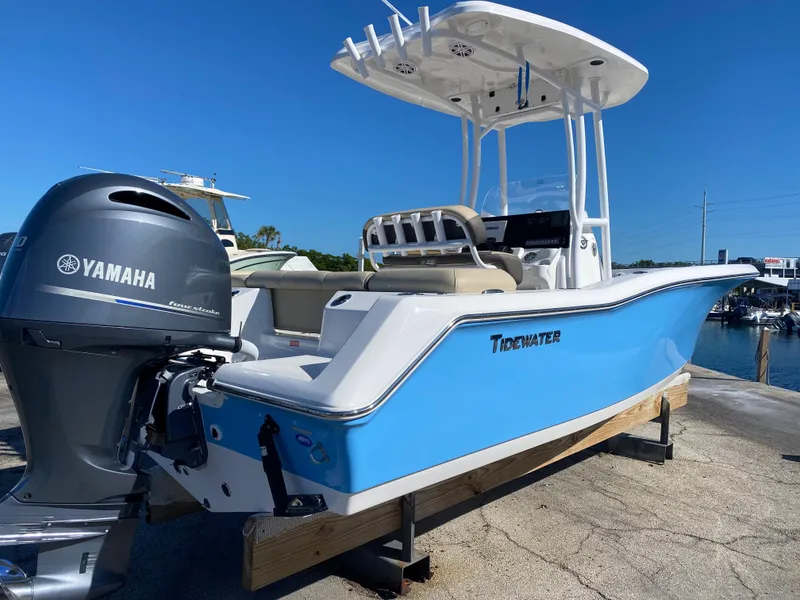 Slide: The Image of 2021 Tidewater 210 LXF boat with Yamaha engine docked at marina. - 7