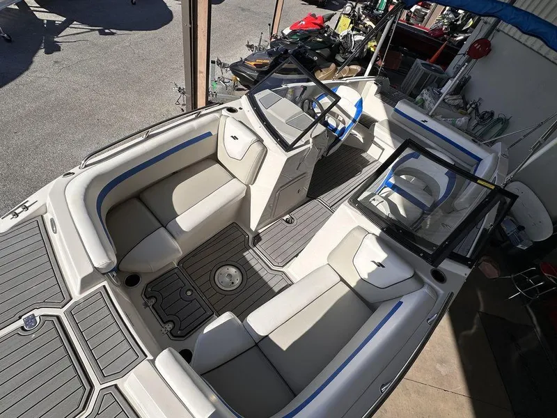 Slide: The Image of 2023 Starcraft SVX OB 210 OB DC boat interior with spacious seating and modern design. - 4