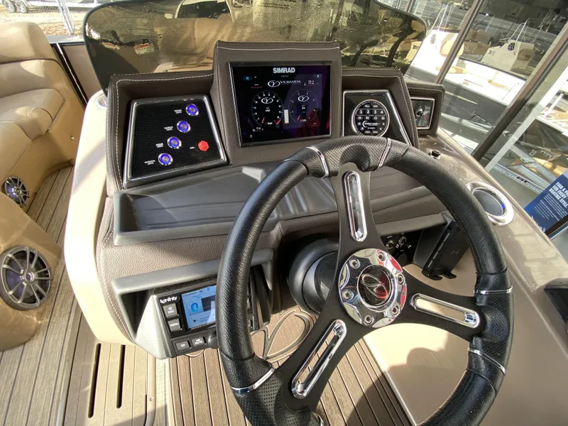 Slide: The Image of 2023 Veranda VTX 22RC boat dashboard with steering wheel and control panel. - 17
