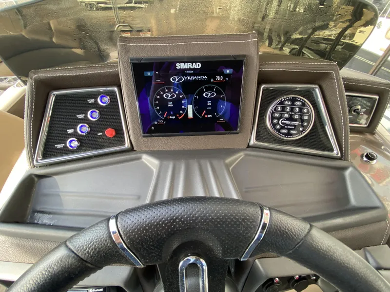 Slide: The Image of 2023 Veranda VTX 22RC dashboard with Simrad display and control panel. - 24