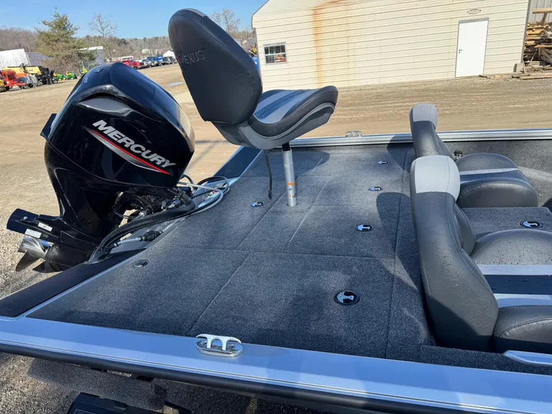 Slide: The Image of 2023 Vexus AVX181 boat with Mercury engine, featuring spacious seating and deck. - 10