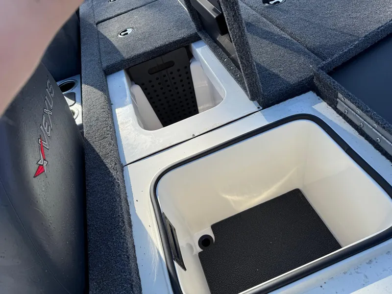Slide: The Image of 2023 Vexus AVX181 boat storage compartments with open lids, showcasing interior design. - 14
