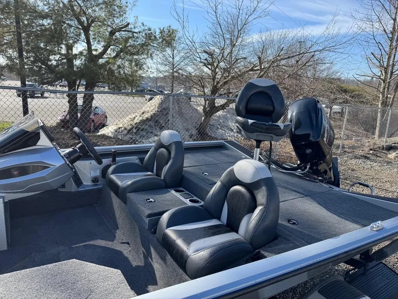 Slide: The Image of 2023 Vexus AVX181 boat with sleek seating and modern design, parked outdoors. - 16