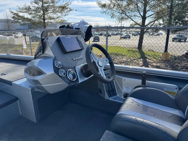 Slide: The Image of 2023 Vexus AVX181 boat interior with steering wheel and control panel. - 17