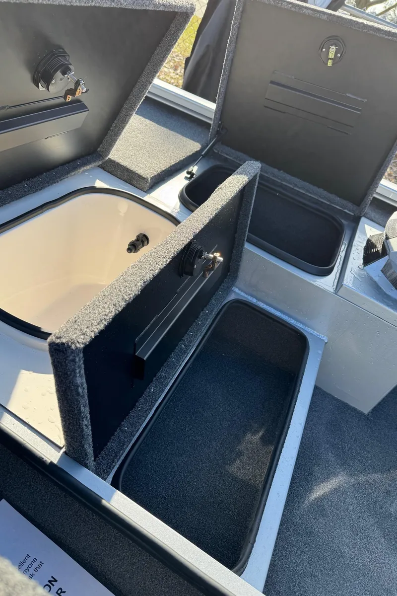 Slide: The Image of 2023 Vexus AVX181 boat storage compartments open, showcasing interior design and functionality. - 19
