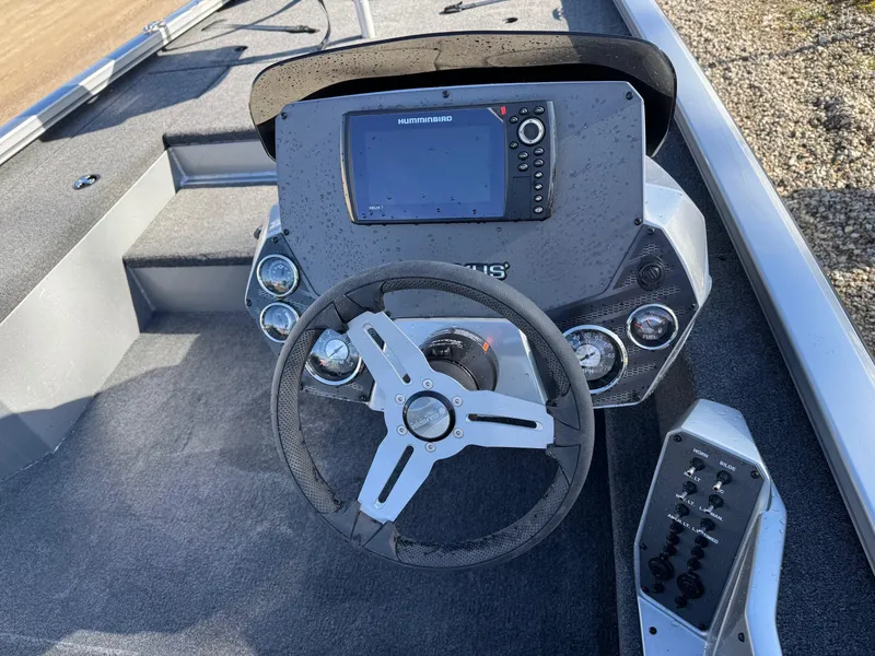 Slide: The Image of 2023 Vexus AVX181 boat dashboard with steering wheel and electronic display. - 21