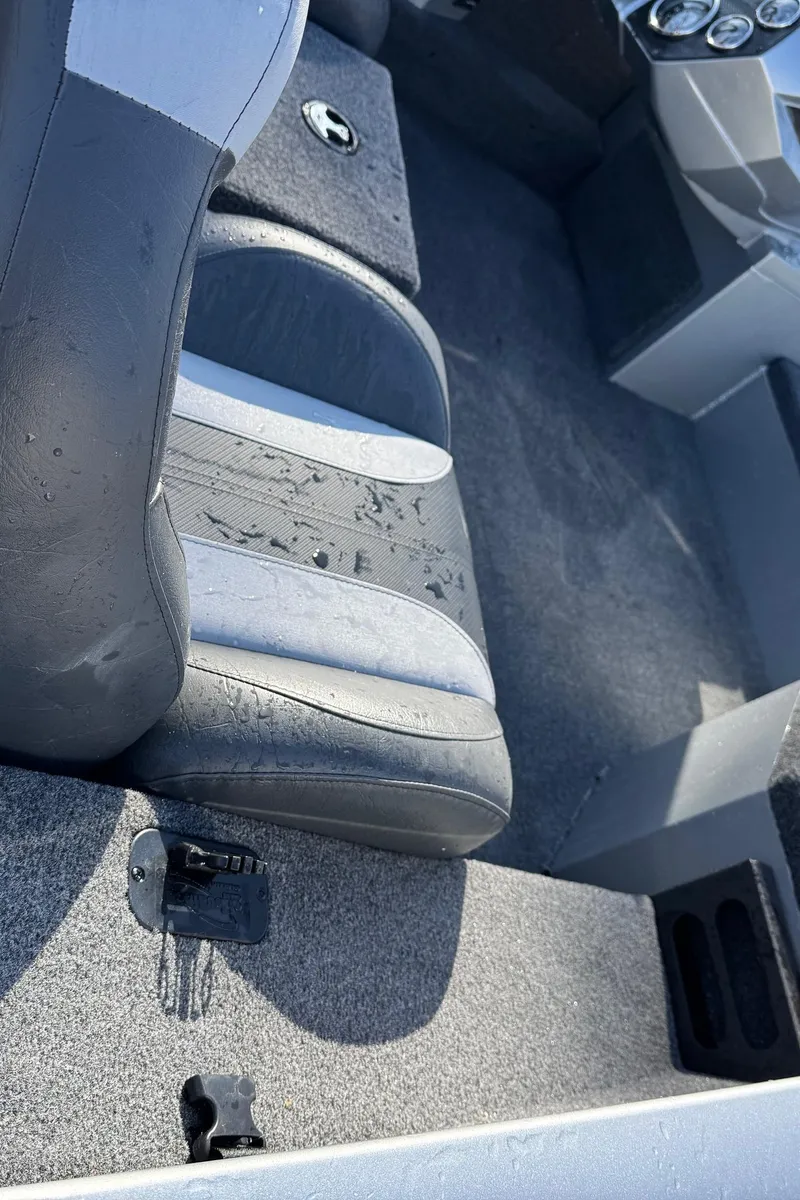 Slide: The Image of 2023 Vexus AVX181 boat interior with gray seating and carpeted flooring. - 22