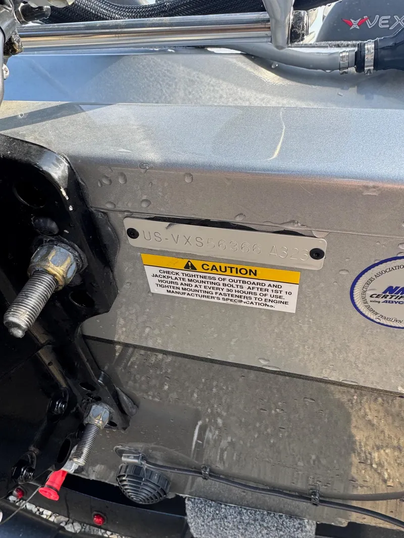 Slide: The Image of 2023 Vexus AVX181 boat detail with caution label and visible wiring. - 24