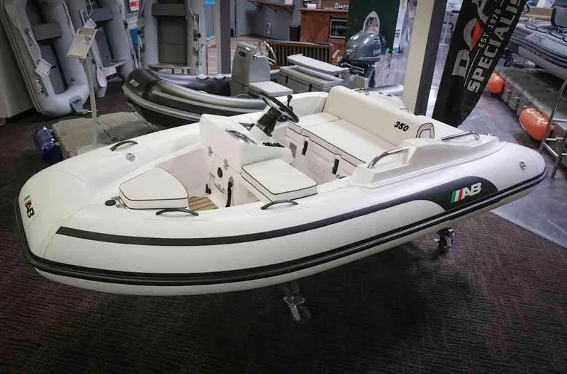 The Image of 2023 AB Inflatables JET 350 XP inflatable boat on display indoors. - 2