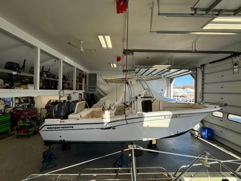Slide: The Image of 2010 Grady-White 257 Advance boat in a spacious garage. - 1