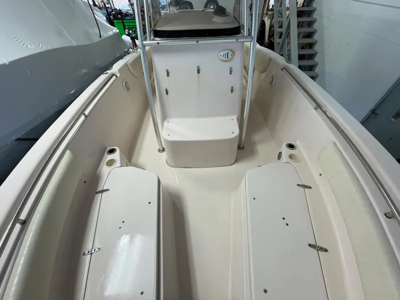 Slide: The Image of 2010 Grady-White 257 Advance boat interior with seating and storage compartments. - 12