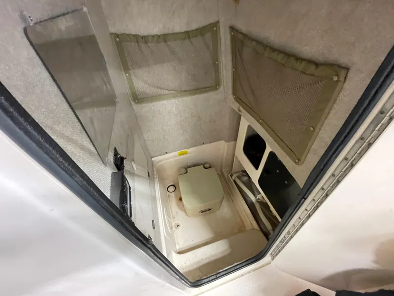 Slide: The Image of Interior cabin of 2010 Grady-White 257 Advance boat with storage compartments. - 17
