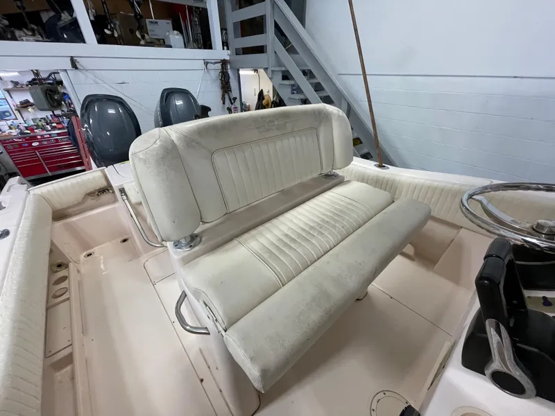 Slide: The Image of 2010 Grady-White 257 Advance boat interior with dual seating and steering wheel. - 24