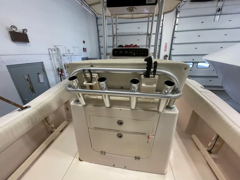 Slide: The Image of 2010 Grady-White 257 Advance boat interior with rod holders and storage compartments. - 25