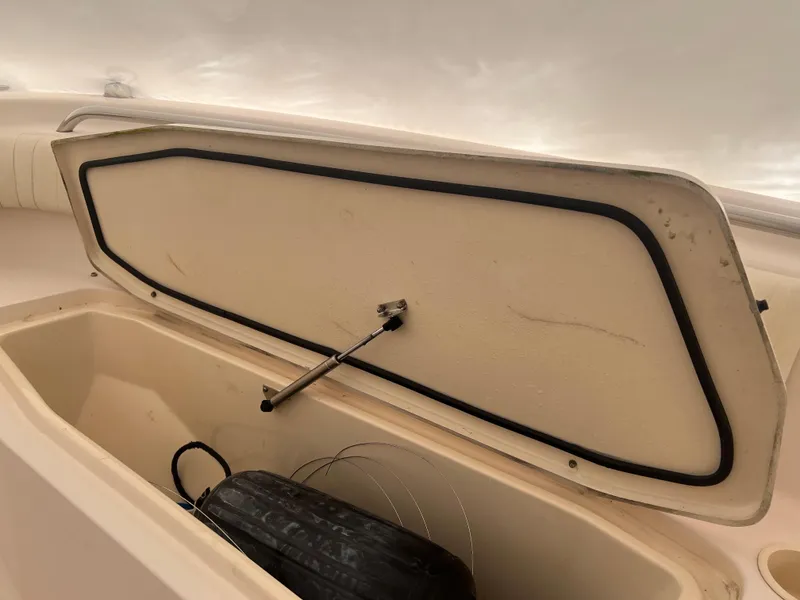 Slide: The Image of Open storage compartment on 2010 Grady-White 257 Advance boat. - 31