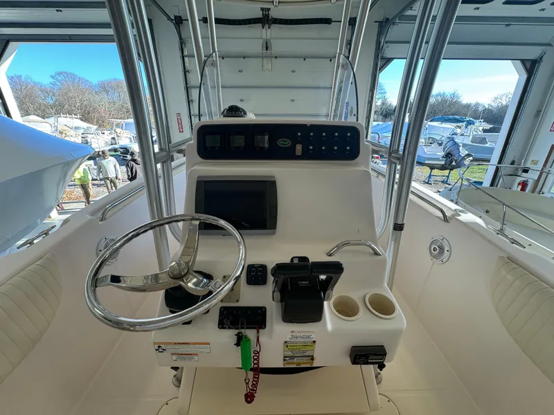Slide: The Image of Grady-White 257 Advance 2010 boat console with steering wheel and controls. - 35