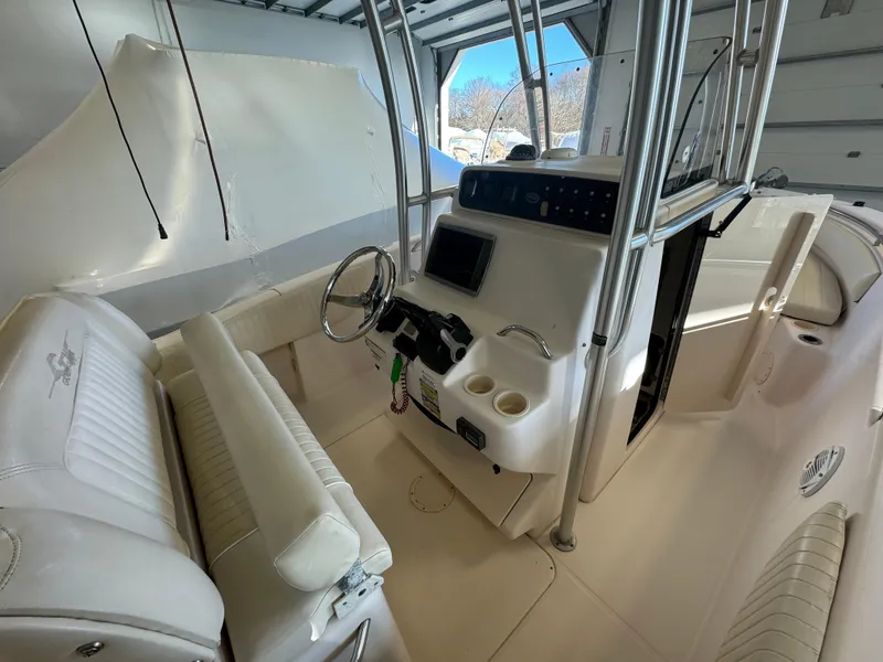 Slide: The Image of 2010 Grady-White 257 Advance boat interior with steering console and seating. - 43