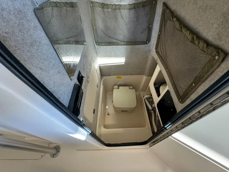 Slide: The Image of Interior cabin of 2010 Grady-White 257 Advance boat with compact toilet. - 44