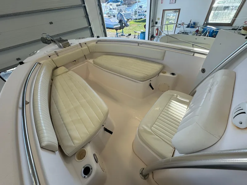 Slide: The Image of 2010 Grady-White 257 Advance boat interior with white cushioned seating. - 46