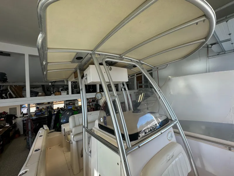 Slide: The Image of 2010 Grady-White 257 Advance boat interior with T-top and helm station. - 49