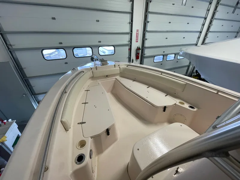 Slide: The Image of 2010 Grady-White 257 Advance boat interior in a garage setting. - 7