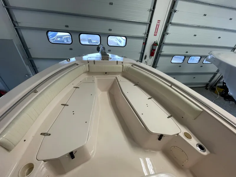 Slide: The Image of 2010 Grady-White 257 Advance boat interior in a garage setting. - 8