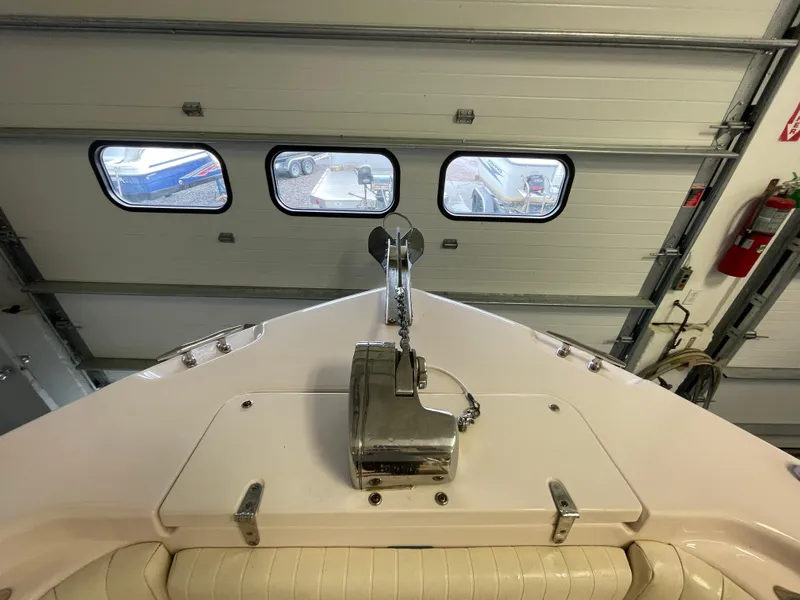 Slide: The Image of 2010 Grady-White 257 Advance boat bow in garage, anchor visible. - 9
