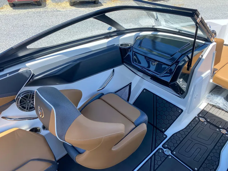 Slide: The Image of 2022 Scarab 215 ID Wake boat interior with tan and black seating. - 11