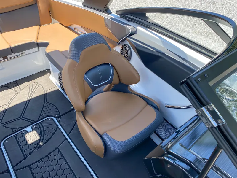 Slide: The Image of 2022 Scarab 215 ID Wake boat interior with brown and gray seating. - 12