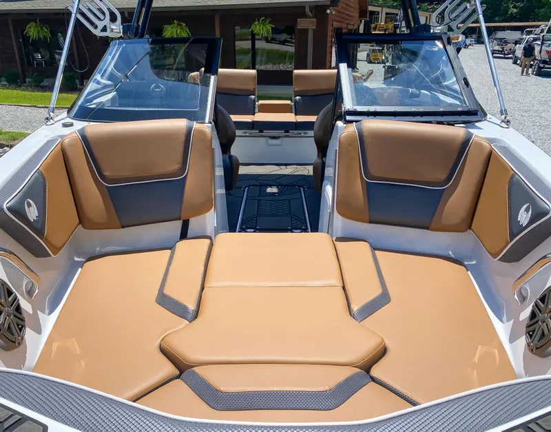 Slide: The Image of 2022 Scarab 215 ID Wake boat interior with tan and gray seating. - 13