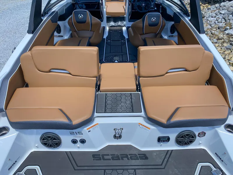 Slide: The Image of 2022 Scarab 215 ID Wake boat interior with tan seating and modern design. - 15