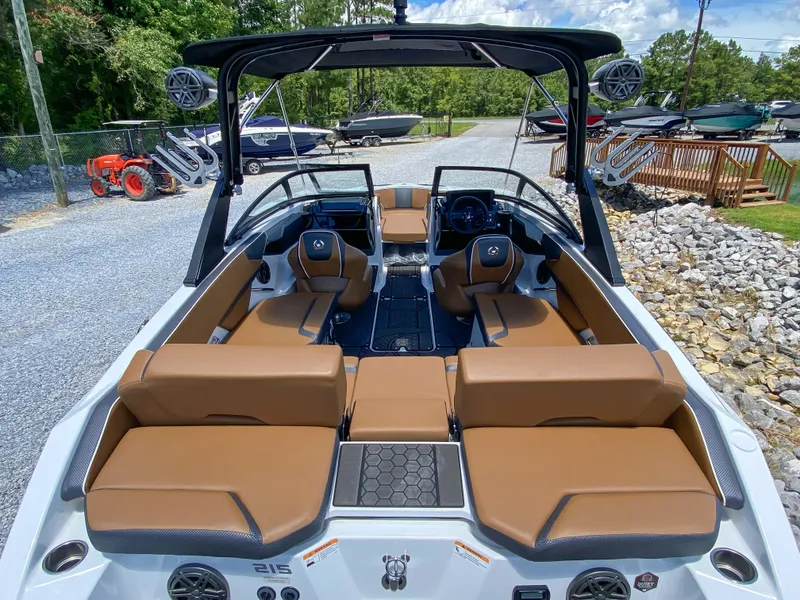 Slide: The Image of 2022 Scarab 215 ID Wake boat with tan seating and black accents. - 16