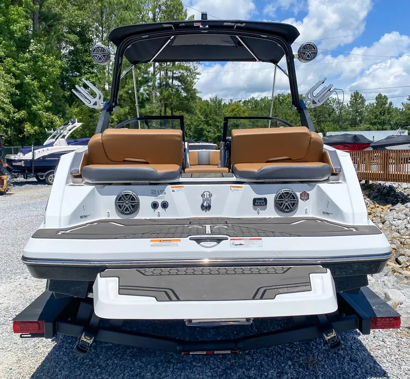 Slide: The Image of 2022 Scarab 215 ID Wake boat rear view with speakers and seating. - 17