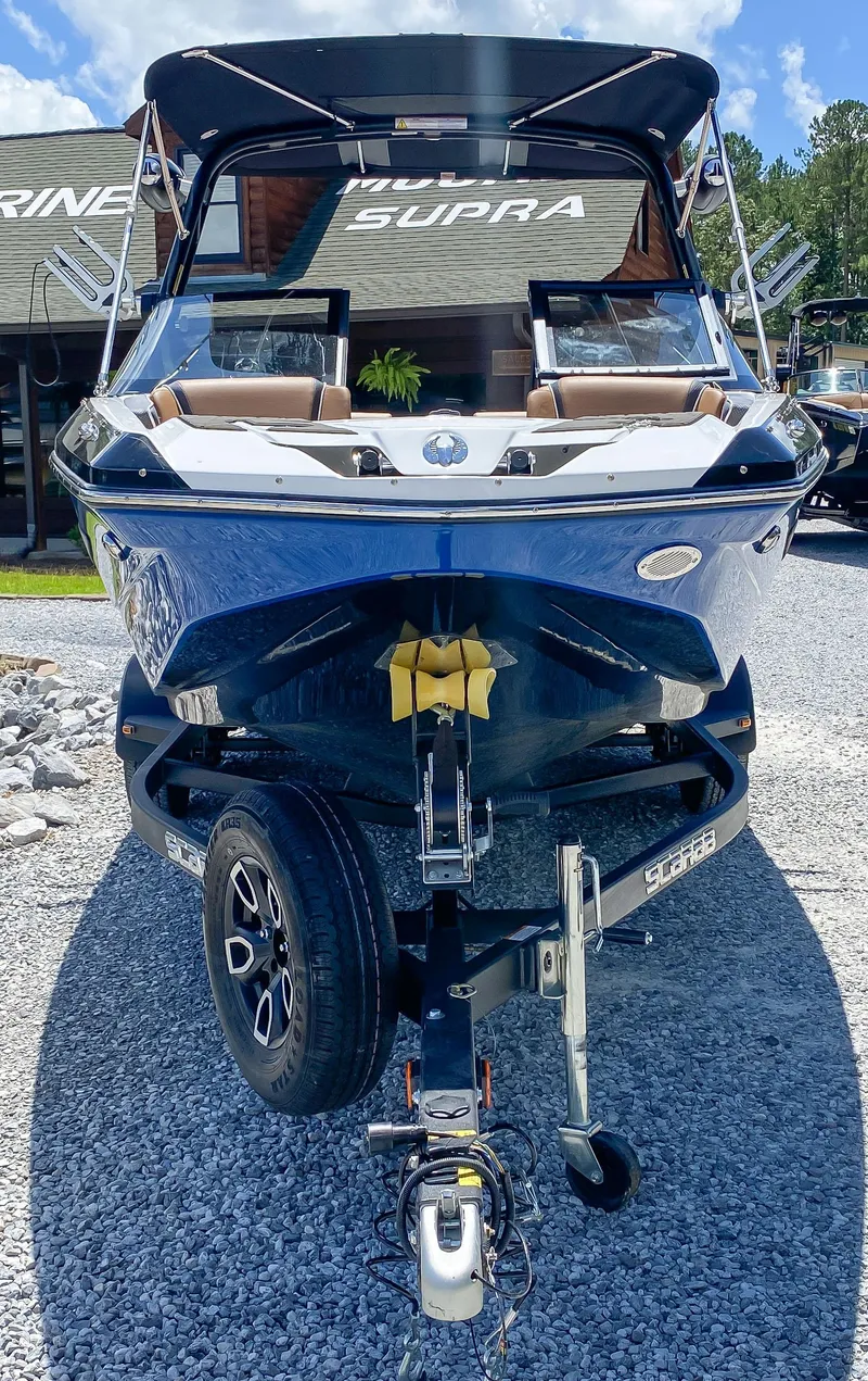 Slide: The Image of 2022 Scarab 215 ID Wake boat on trailer, front view. - 22