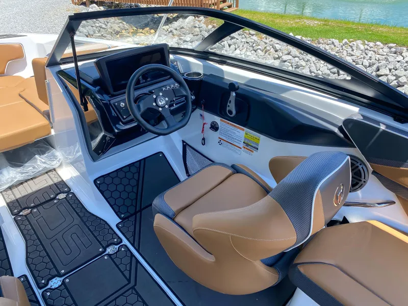 Slide: The Image of 2022 Scarab 215 ID Wake boat interior with modern dashboard and comfortable seating. - 9