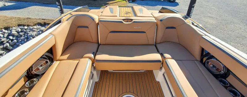 Slide: The Image of 2022 MasterCraft XStar boat interior with tan leather seating and premium finishes. - 8