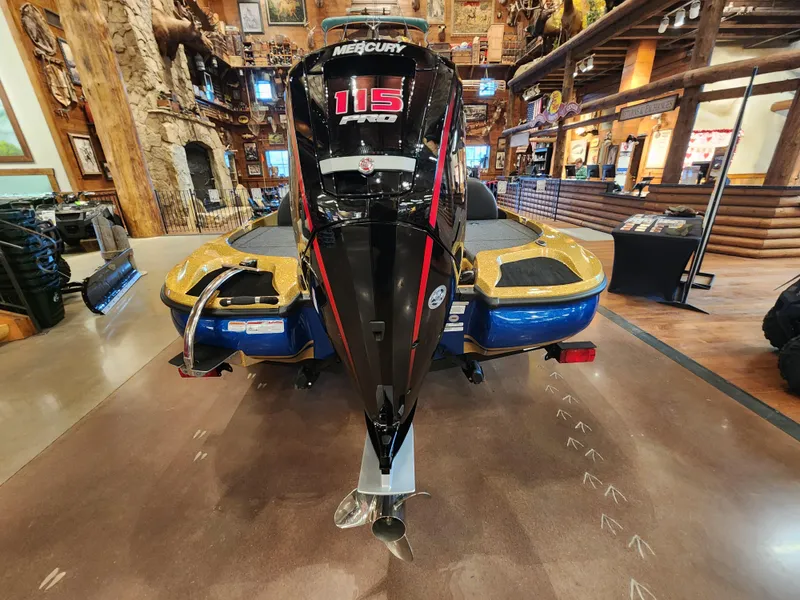 Slide: The Image of 2023 Nitro Z17 boat with Mercury 115 Pro XS engine displayed indoors. - 4