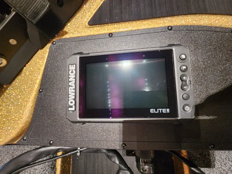 Slide: The Image of Lowrance Elite fish finder on 2023 Nitro Z17 boat dashboard. - 6