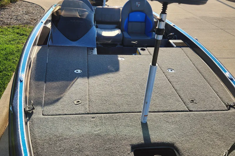 Slide: The Image of 2023 Triton 19 TrX fishing boat with spacious deck and seating. - 3