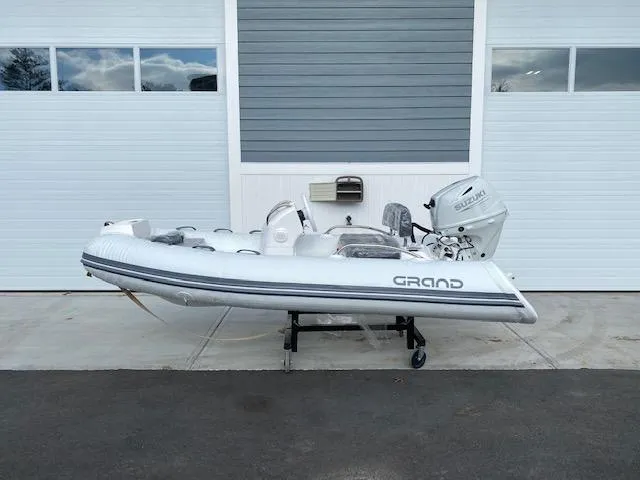 Slide: The Image of 2023 Grand G 340 w/ DF25ATSW inflatable boat on a trailer. - 2