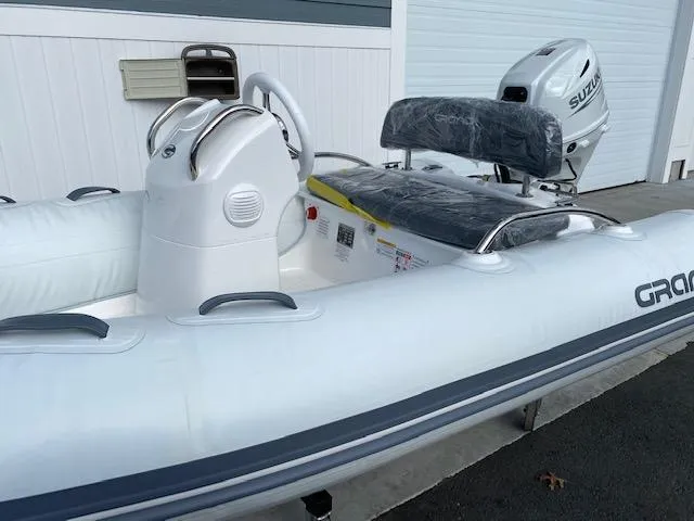 Slide: The Image of 2023 Grand G 340 inflatable boat with Suzuki DF25ATSW outboard motor. - 6