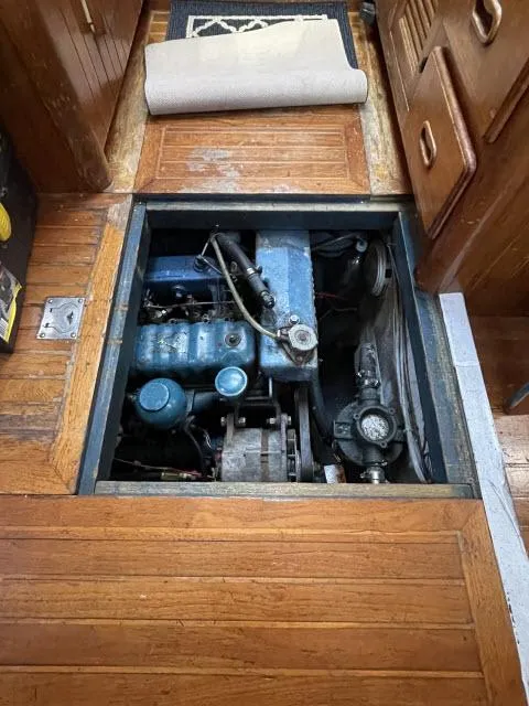 Slide: The Image of 1982 Formosa 42 engine compartment with wooden flooring. - 14
