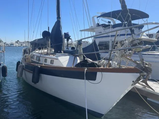 Slide: The Image of 1982 Formosa 42 sailboat docked in a marina. - 16
